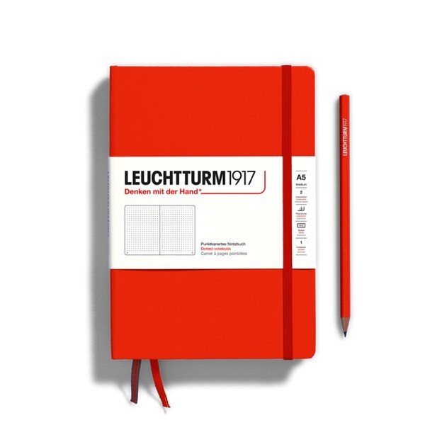 Fox red hardcover dotted notebook with closure strap and two bookmarks.